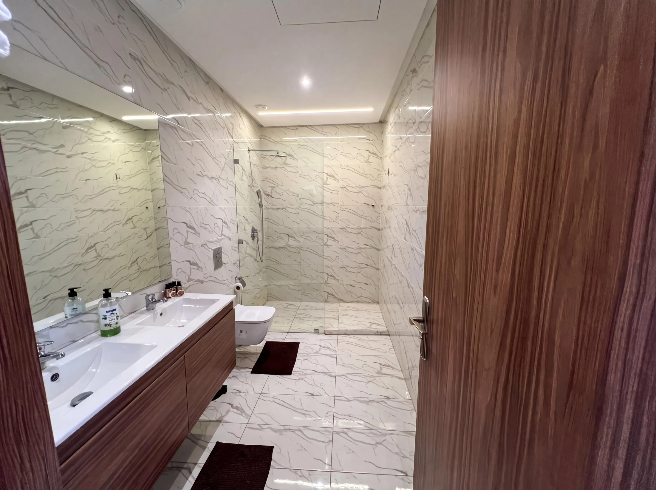 Marble bathroom with walk-in shower at The Villa 303, Argan Golf Resort, Marrakech